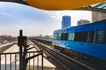 Fototapeta premium Metro railway train in Dubai city in UAE