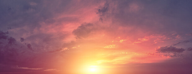 Horizontal panorama of a dramatic red black glowing cloudy sky at sunset. Sky texture. Abstract nature background