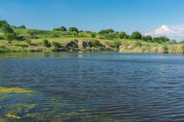Rural landscape with small river Sura at late spring season, central Ukraine