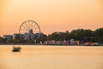 2021.07.23. Hungary, Siofok. Sunrise landsacpe in the lake Balaton. Included with Ferris wheel and...