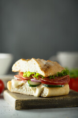 Homemade sandwich with salami and cucumber