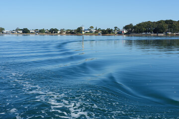 View across the water from Coochiemudlo vehicular ferry to the shoreline of Victoria Point.