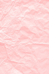 Fototapeta premium Crumpled salmon pink paper textured background
