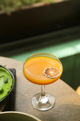 Refreshing orange cocktail served for one