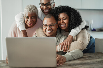 Happy black family doing video call at home - Main focus on father face