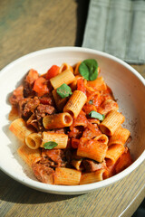 Pasta with braised duck and tomatoes