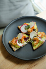 Bruschetta with shrimps and avocado