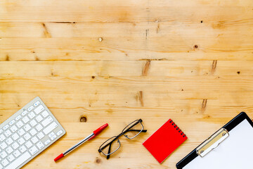 Office desk table mock up with computer keyboard and notepad