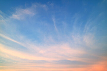 Naklejka na ściany i meble Cirrus Clouds on Sunset Sky with Pastel Color Afterglow