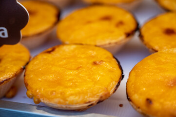 Traditional dessert pastry in Portugal, nata eggs cream cakes with fruits