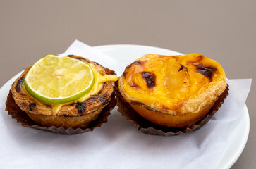 Traditional dessert pastry in Portugal, nata eggs cream cakes with fruits