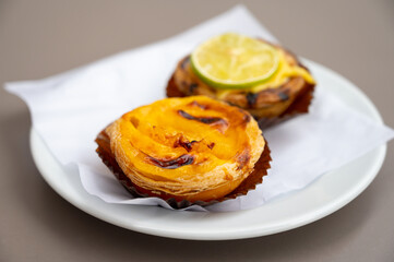 Traditional dessert pastry in Portugal, nata eggs cream cakes with fruits