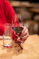 Professional tasting of different fortified dessert ruby, tawny port wines in glasses in porto cellars in Vila Nova de Gaia, Portugal