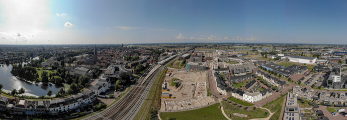 Aerial 180 degrees panorama with Ubuntuplein construction site in urban development of real estate investment project in new Noorderhaven neighbourhood. Housing shortage and engineering concept.
