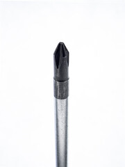 old screwdriver phillips head close up on white background.