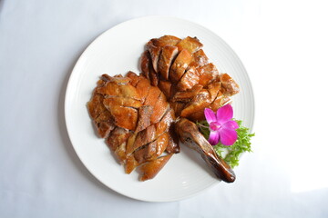 roasted bbq golden Beijing peking whole duck meat in white background asian halal menu
