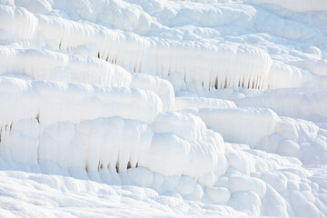 White texture of travertine terraces at Pamukkale, Turkey