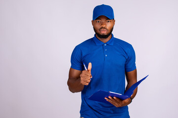 black delivery worker holding a manifest, does a thumbs up gesture