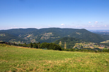Fototapeta premium View on the surrounding mountains from the top of Zar Mountain