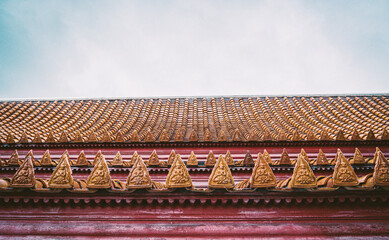 traditional architecture with ornament and statue dragons on roof of 
Marble Temple of Bangkok, Thailand.
