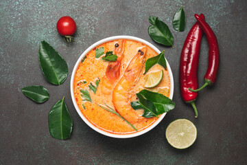 Tom Yam kung spicy Thai soup with  prawn and coconut milk. Traditional  asian spicy coconut milk...