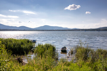 Boats on the Żywieckie Lake on a hot summer afternoon