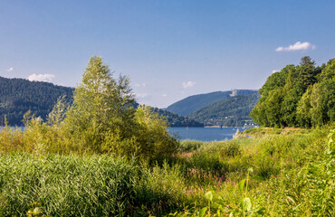 View on the Żywieckie Lake and the Żar Mountain in the background on a sunny afternoon