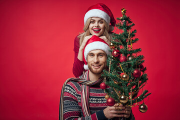 young couple christmas holiday fun romance red background