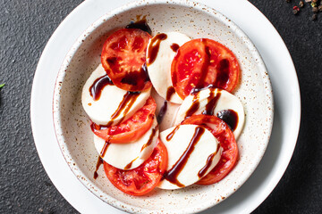 caprese salad mozzarella cheese, tomato basil leaf italian snack copy space food background rustic. top view keto or paleo diet veggie vegetarian food