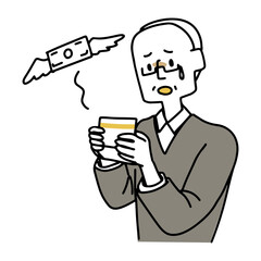 貯金通帳を見てがっかりしている高齢男性