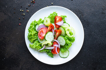salad vegetable tomato, cucumber, pepper, onion, lettuce meal snack copy space food background rustic. top view keto or paleo diet veggie vegan or vegetarian food 