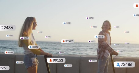 Multiple digital icons with increasing numbers over caucasian couple riding electric scooters - Powered by Adobe