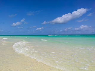 Fototapeta na wymiar Cayo Guillermo, Cuba, 16 may 2021: People swim in the azure waters of the white Pilar beach on the island Cayo Guillermo. Playa Pilar is very popular with tourists.