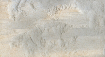 Textura de superficie de pedra rugosa com cores beges e sépias - com relevos irregulares
