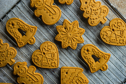 Assorted Christmas gingerbread cookies on a metal cooling rack