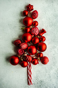Conceptual Christmas tree made from red Christmas baubles and candy canes