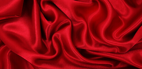 Obraz premium Smooth elegant red silk or satin luxury cloth texture as abstract background. Luxurious valentines day background design
