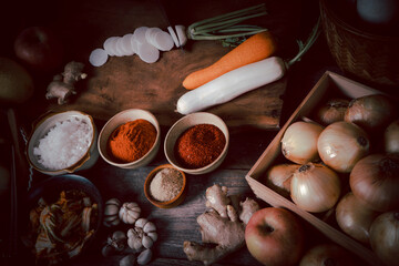 Fresh ingredients and vegetables Placed in the table For making Kimchi Which contains ingredients such as ginger, garlic, salt, onion, sugar, gochugaru (Korean chili). Kimchi is a healthy food.