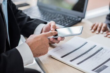 business man check email or message by smart phone touch screen