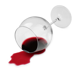 Overturned glass and spilled wine on white background