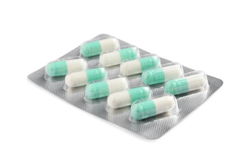 Blister with bright pills isolated on white