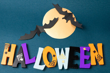 Happy Halloween wooden letters with pumpkins, spiders and other decorations