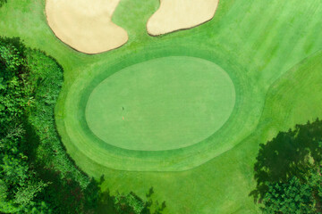 top view of golf pole on the green in a golf course