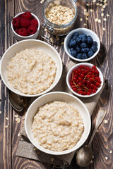 homemade oatmeal and berries, vertical top view