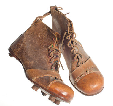 vintage football boots on a white background