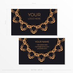 Black business cards with luxurious gold ornaments. Business card design with vintage patterns.