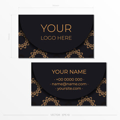 Black business card template with luxurious gold patterns. Print-ready business card design with vintage ornament.