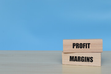 Wooden blocks with text PROFIT MARGINS. Business concept.