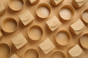 Eco friendly food containers on beige background, flat lay
