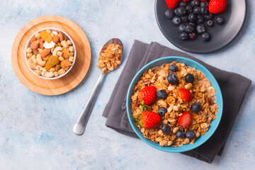 A bowl of healthy strawberry and blueberry cereal for a morning breakfast. A meal to start the day right!
